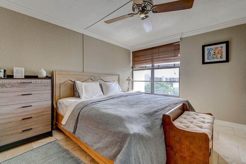 9 Royal Palm Way, Unit 6030 Boca Raton, FL 33432 - Photo 10 of 17 a bedroom with a bed and a window