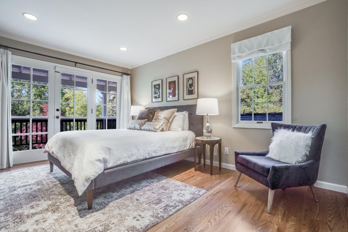 445 Walsh Road Atherton, CA 94027 - Photo 14 of 37 a bedroom with a large bed and a large window
