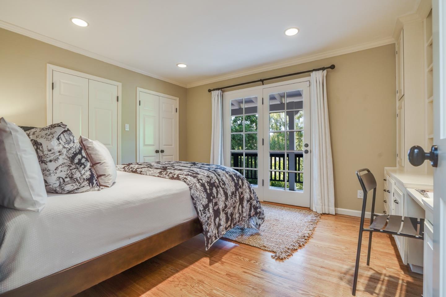 445 Walsh Road Atherton, CA 94027 - Photo 17 of 37 a bedroom with a large bed and a window