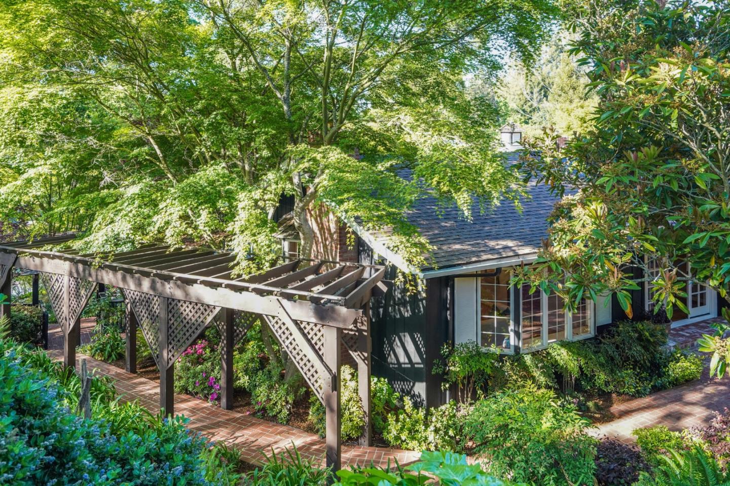 445 Walsh Road Atherton, CA 94027 - Photo 34 of 37 a front view of a house with a garden