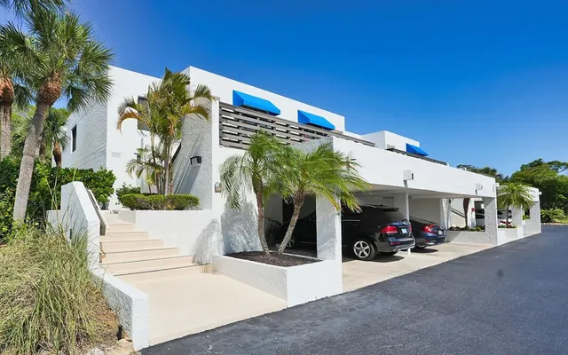 a view of a street with a car parked in front of it