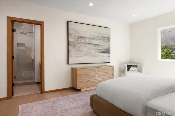a bedroom with a bed and a dresser