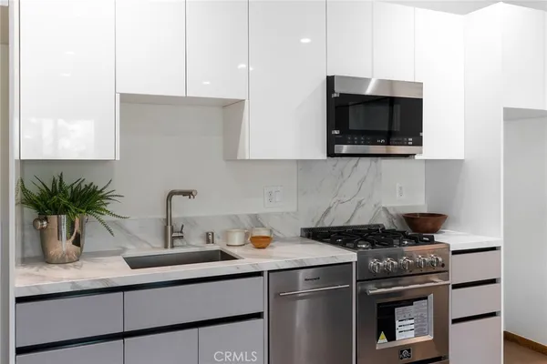 a kitchen with a stove and a microwave