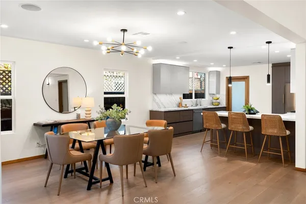 a view of a dining room with furniture window and wooden floor