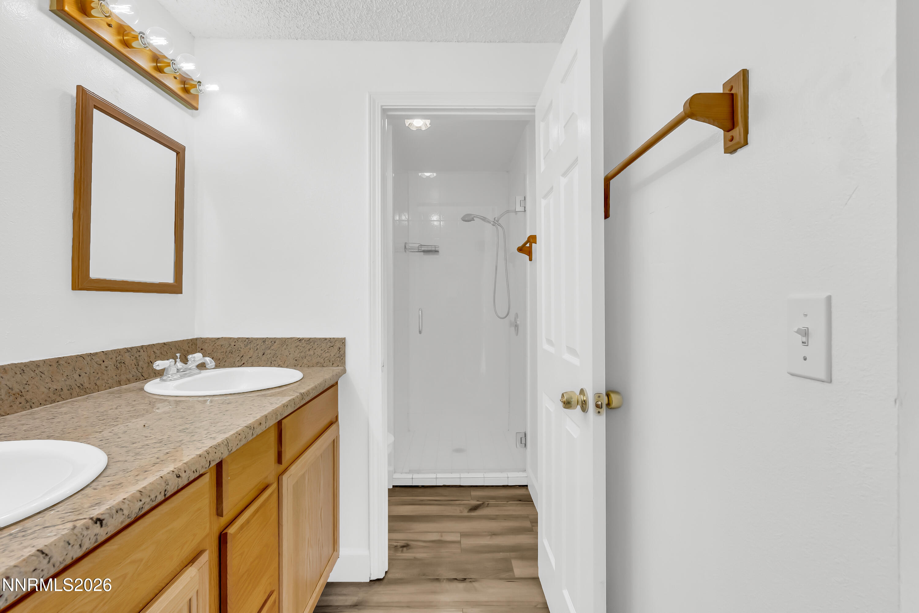 1045 Hartford Court Reno, NV 89503 - Photo 16 of 36 a bathroom with a sink and mirror