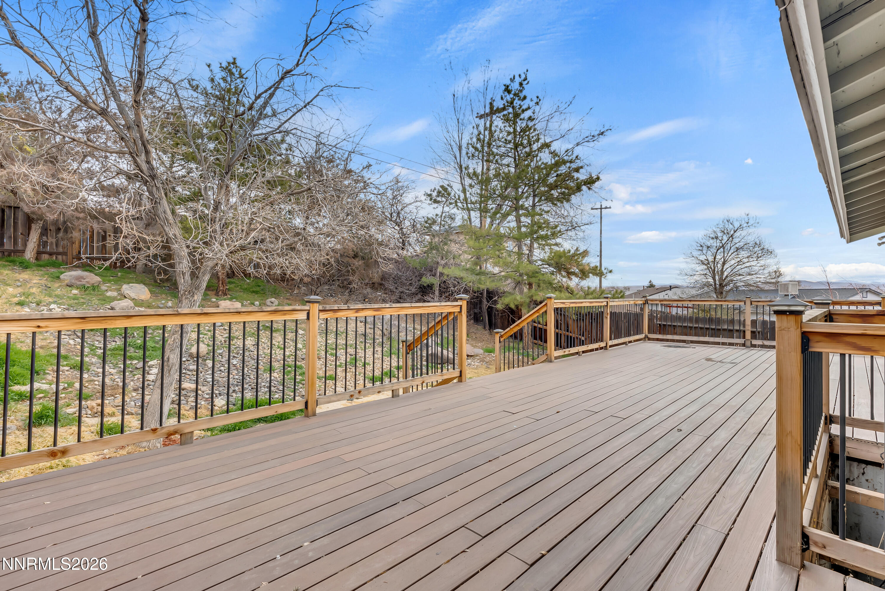 1045 Hartford Court Reno, NV 89503 - Photo 18 of 36 a view of a balcony with wooden floor and fence