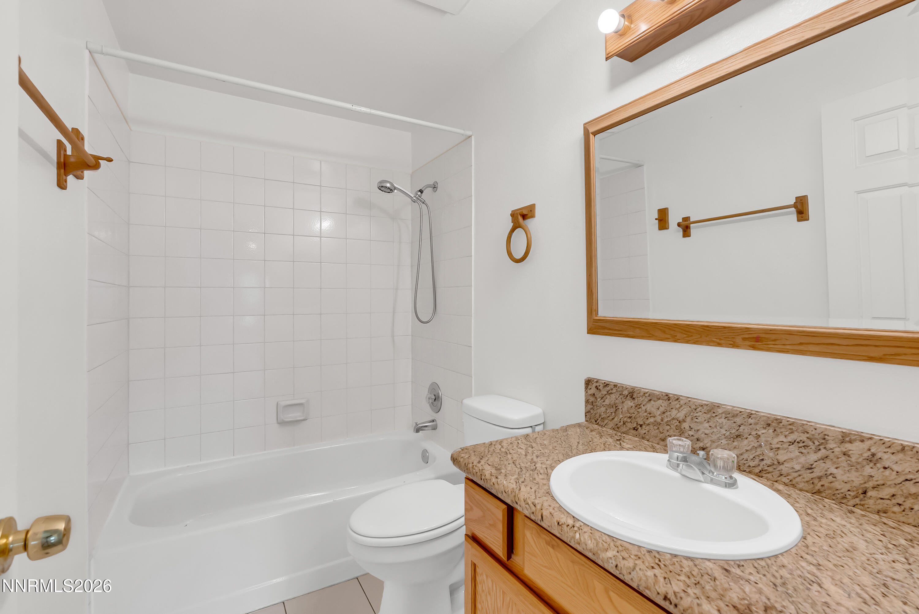 1045 Hartford Court Reno, NV 89503 - Photo 20 of 36 a bathroom with a sink toilet a mirror and shower