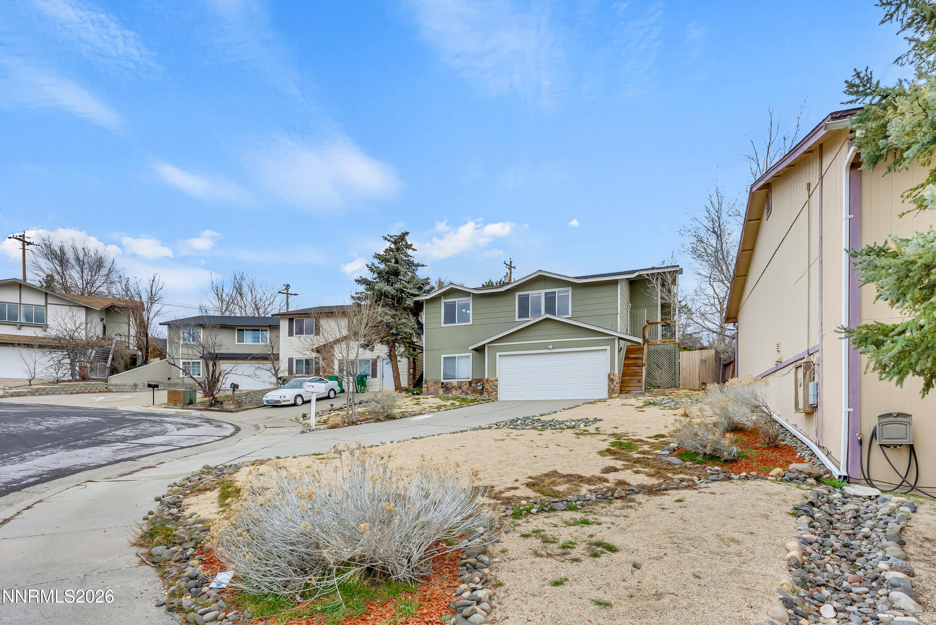 1045 Hartford Court Reno, NV 89503 - Photo 2 of 36 a view of a house with a snow on the road