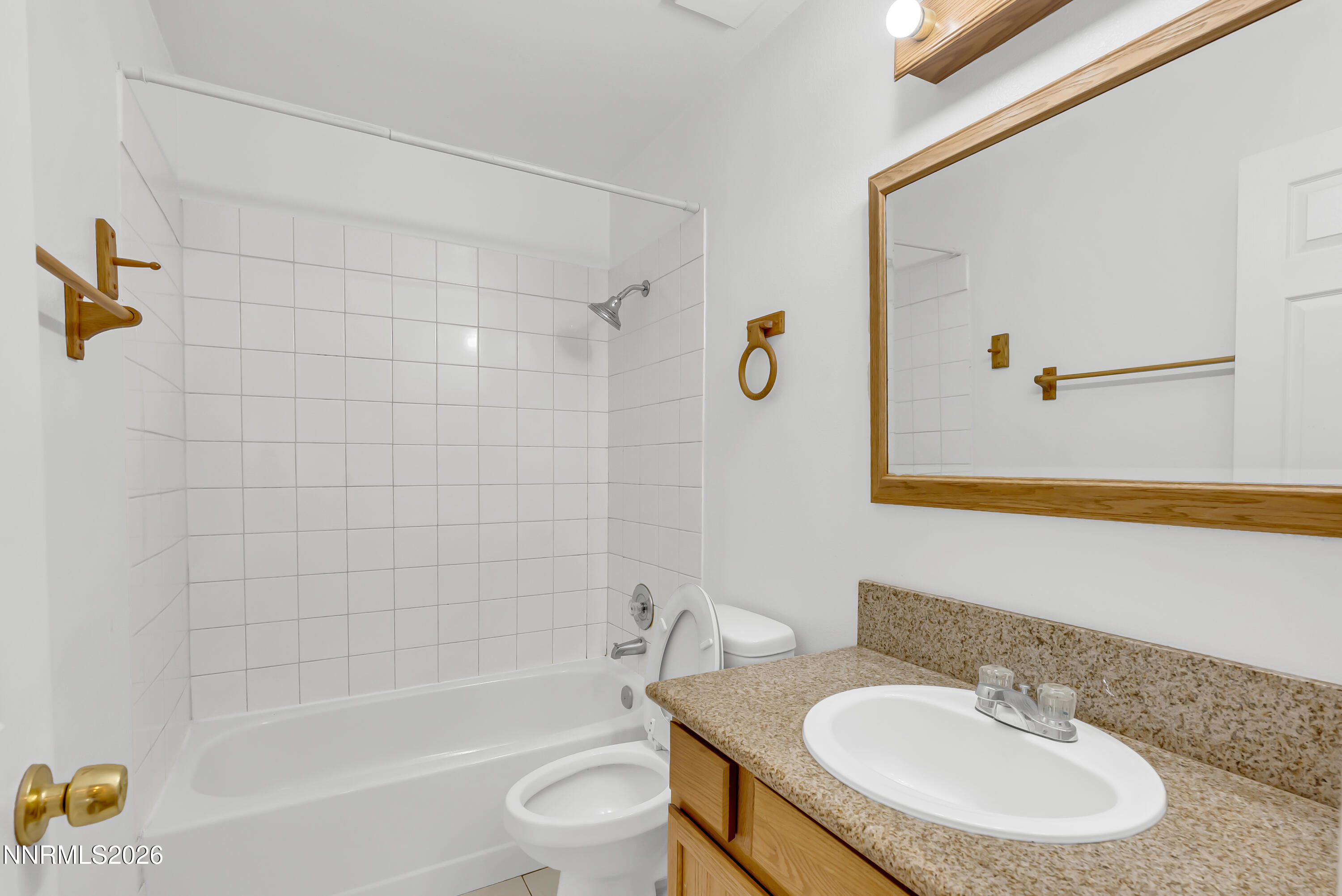 1045 Hartford Court Reno, NV 89503 - Photo 23 of 36 a bathroom with a sink and a mirror
