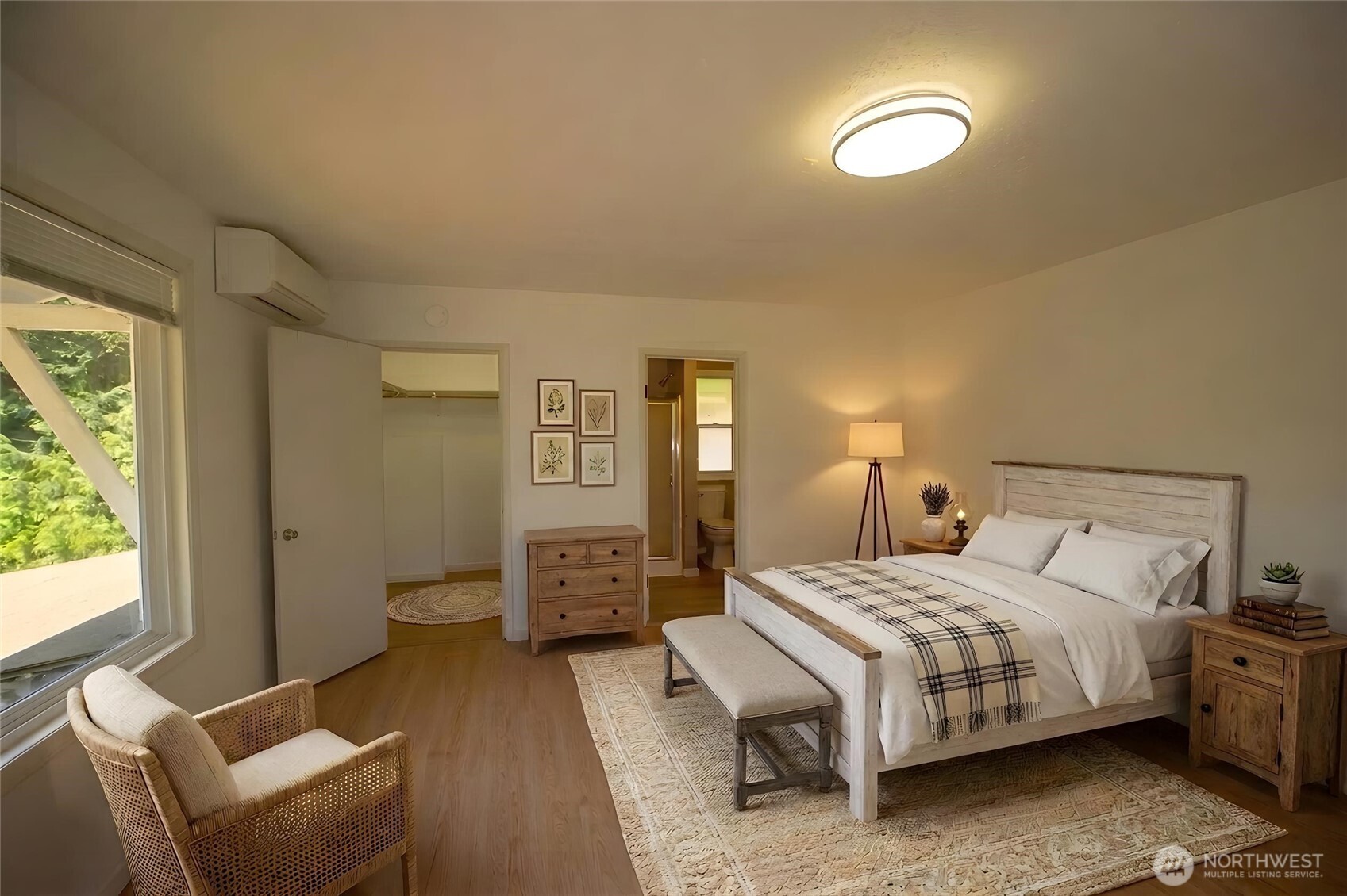89 Slab Camp Road Sequim, WA 98382 - Photo 22 of 40 a bedroom with a bed and wooden floor