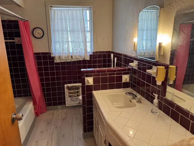 a bathroom with a sink and a shower