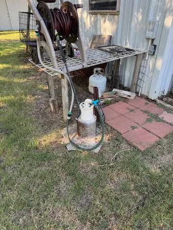 a view of a backyard of the house