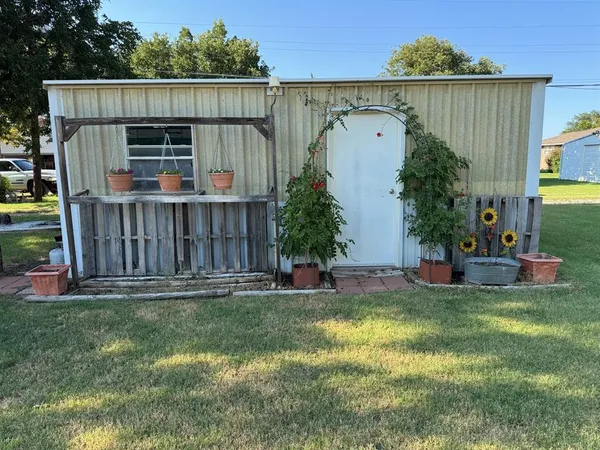 a view of house with backyard and entertaining space