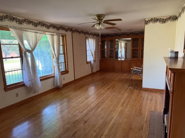 a view of entryway with wooden floor and door
