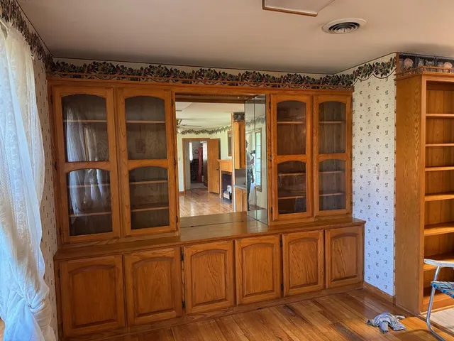 front view of a house with a large window