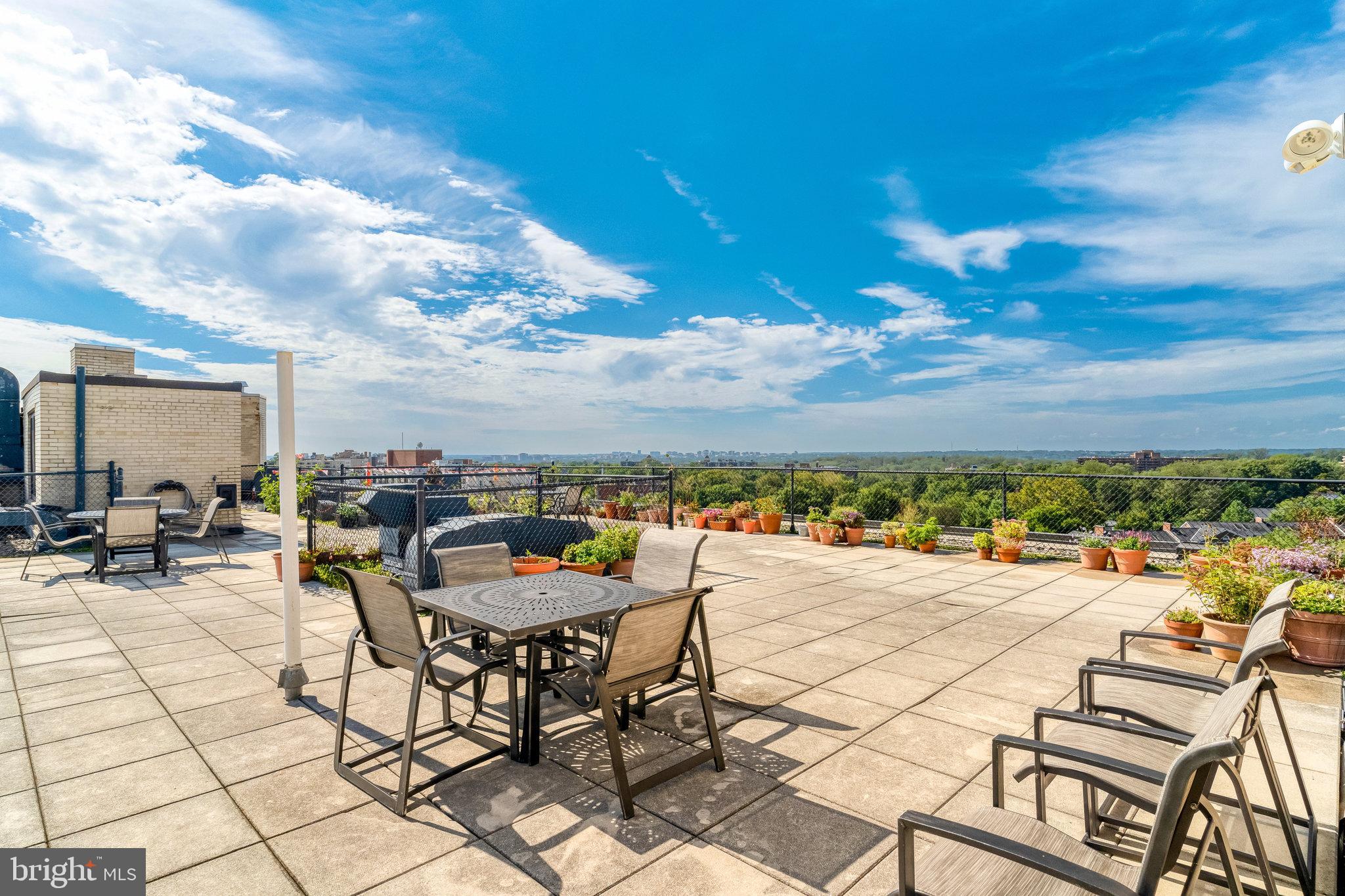 3601 Wisconsin Avenue Northwest, Unit 204 Washington, DC 20016 - Photo 13 of 15 a view of a terrace with furniture and a stove