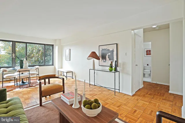 a bedroom with furniture and wooden floor