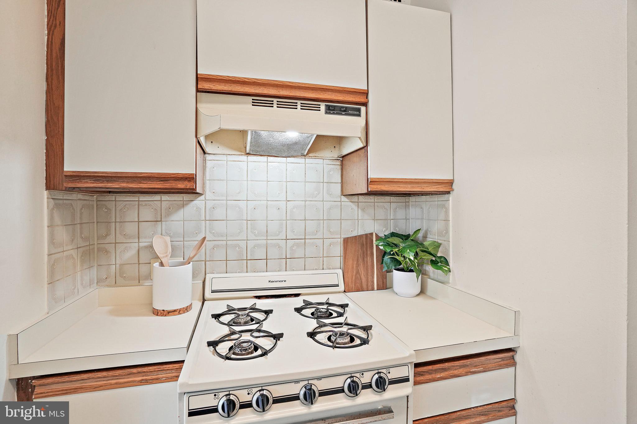 3601 Wisconsin Avenue Northwest, Unit 204 Washington, DC 20016 - Photo 7 of 15 a kitchen with a stove and a microwave