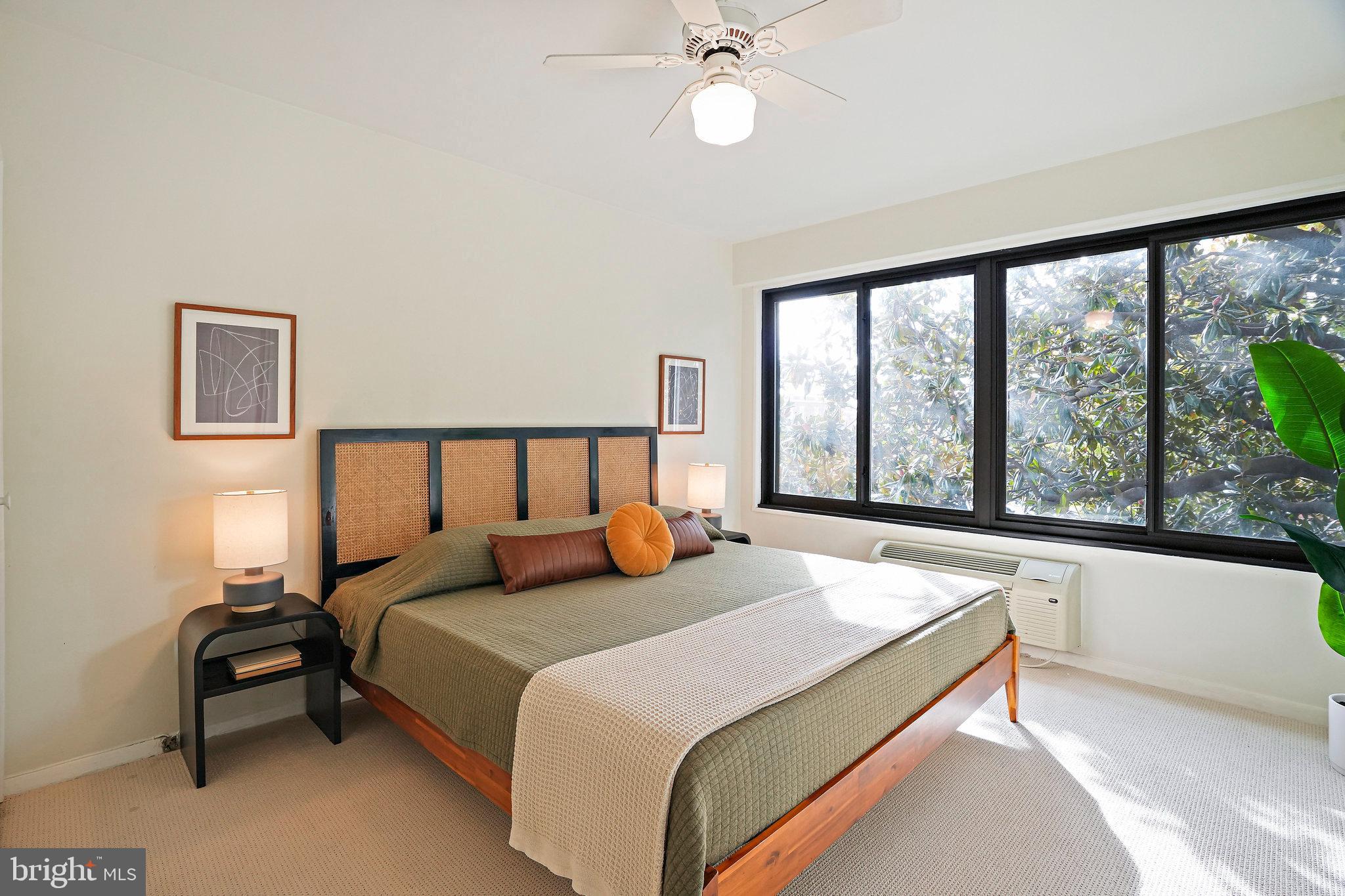 3601 Wisconsin Avenue Northwest, Unit 204 Washington, DC 20016 - Photo 8 of 15 a bedroom with a large bed and a large window