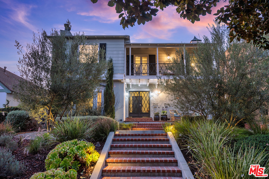 1307 South Rimpau Boulevard Los Angeles, CA 90019 - Photo 1 of 54 a front view of a house