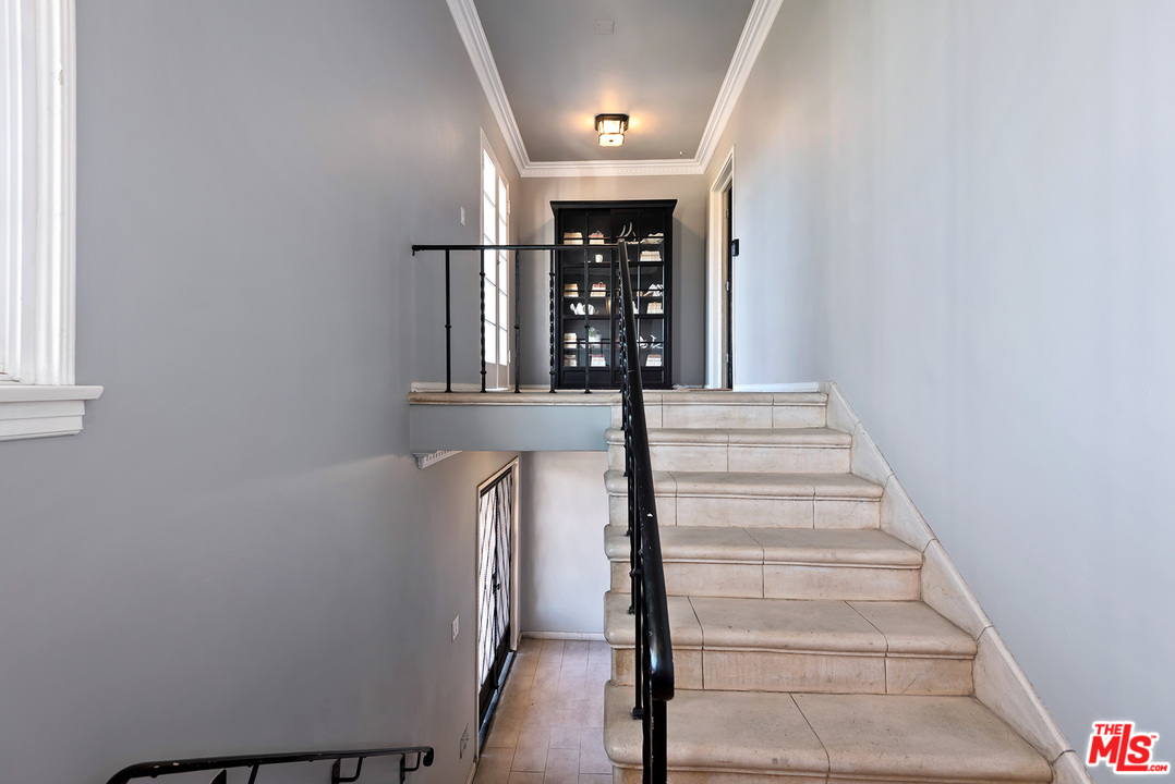 1307 South Rimpau Boulevard Los Angeles, CA 90019 - Photo 27 of 54 a view of entryway and hall with wooden floor