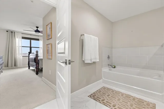 a bathroom with a tub and a shower