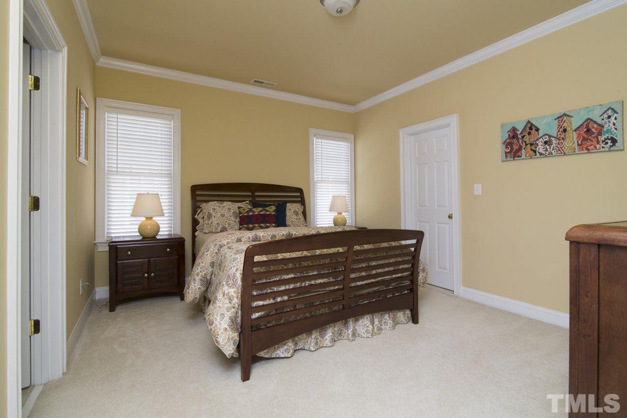 12301 Beestone Lane Raleigh, NC 27614 - Photo 17 of 25 a bedroom with a bed and a window