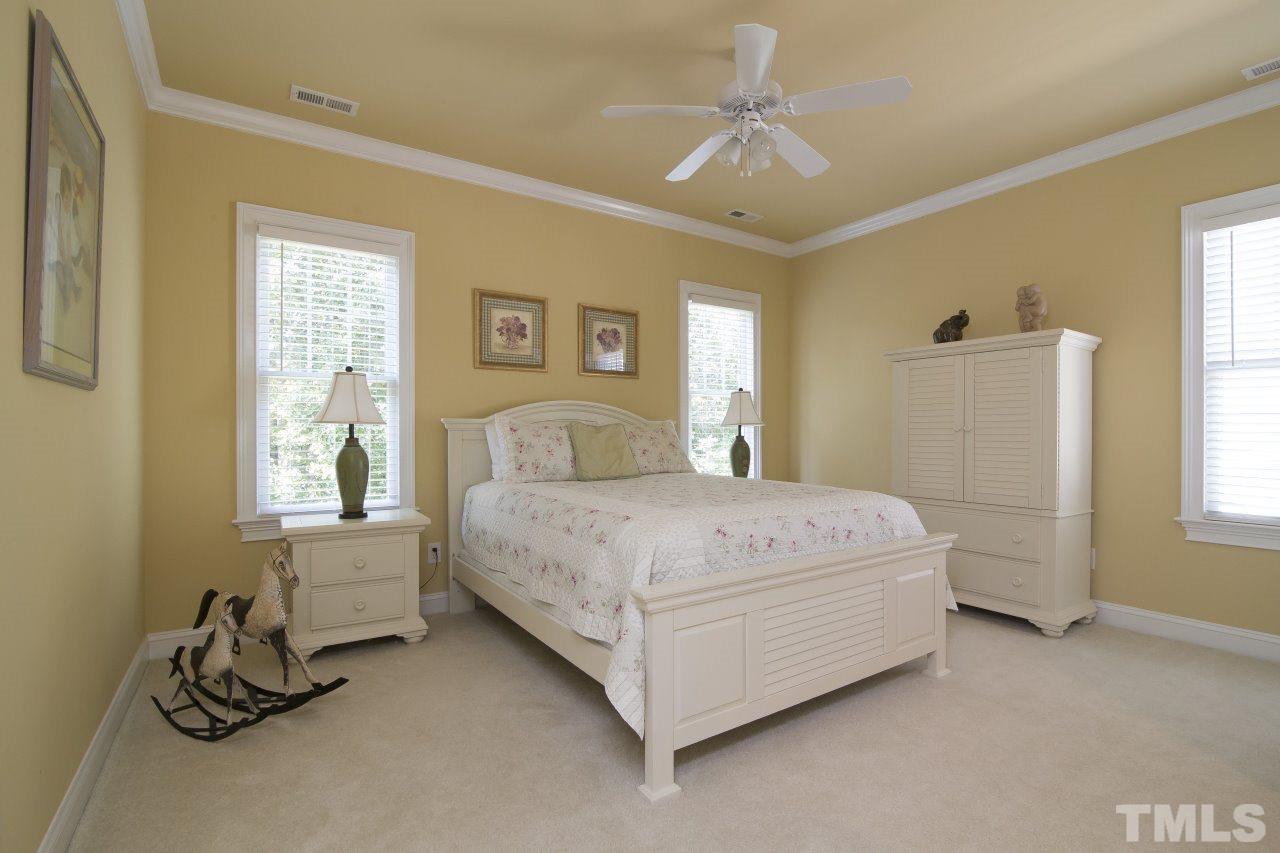 12301 Beestone Lane Raleigh, NC 27614 - Photo 18 of 25 a bedroom with a bed and a window