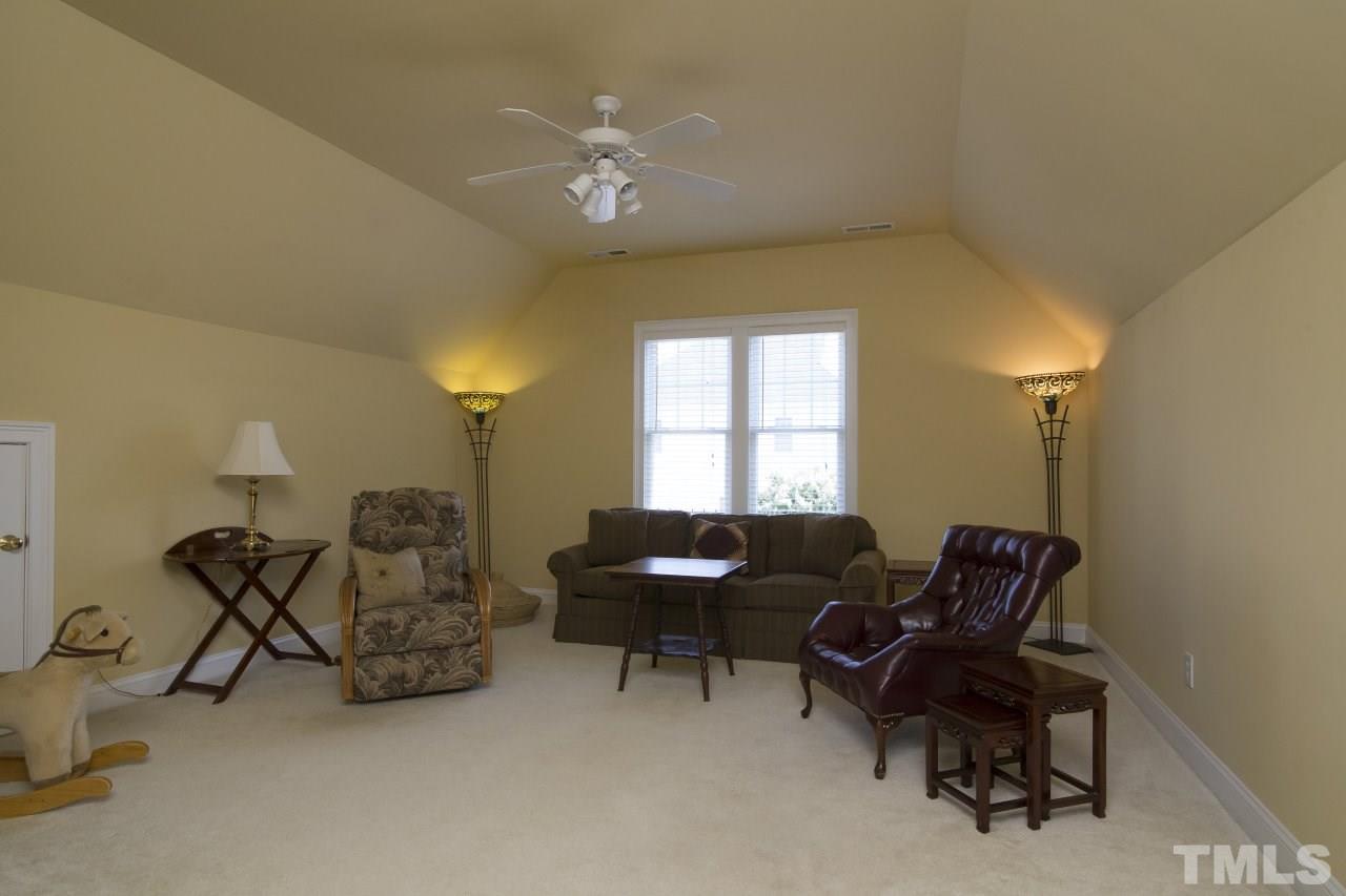 12301 Beestone Lane Raleigh, NC 27614 - Photo 20 of 25 a living room with furniture and a window