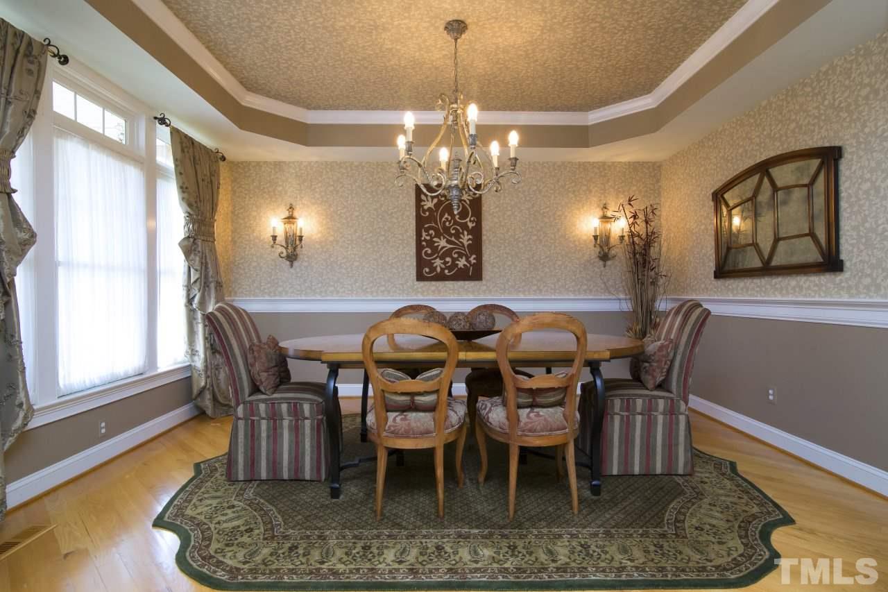 12301 Beestone Lane Raleigh, NC 27614 - Photo 4 of 25 a view of a dining room with furniture