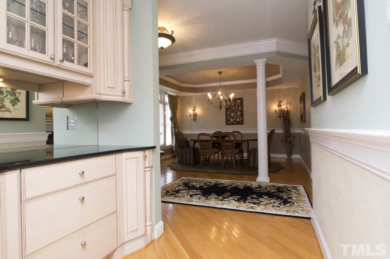 12301 Beestone Lane Raleigh, NC 27614 - Photo 5 of 25 a kitchen with stainless steel appliances granite countertop a stove a refrigerator and a counter space