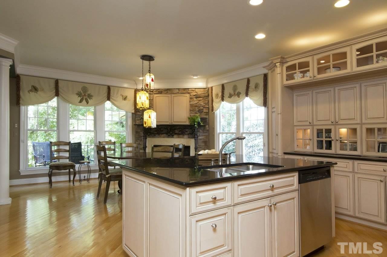 12301 Beestone Lane Raleigh, NC 27614 - Photo 7 of 25 a kitchen with a large window in it