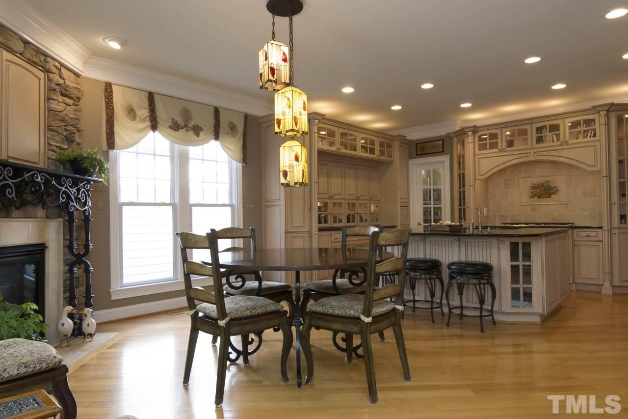 12301 Beestone Lane Raleigh, NC 27614 - Photo 8 of 25 a view of a dining room with furniture window and wooden floor