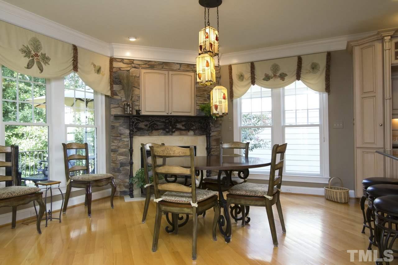 12301 Beestone Lane Raleigh, NC 27614 - Photo 9 of 25 a dining room with furniture window and wooden floor