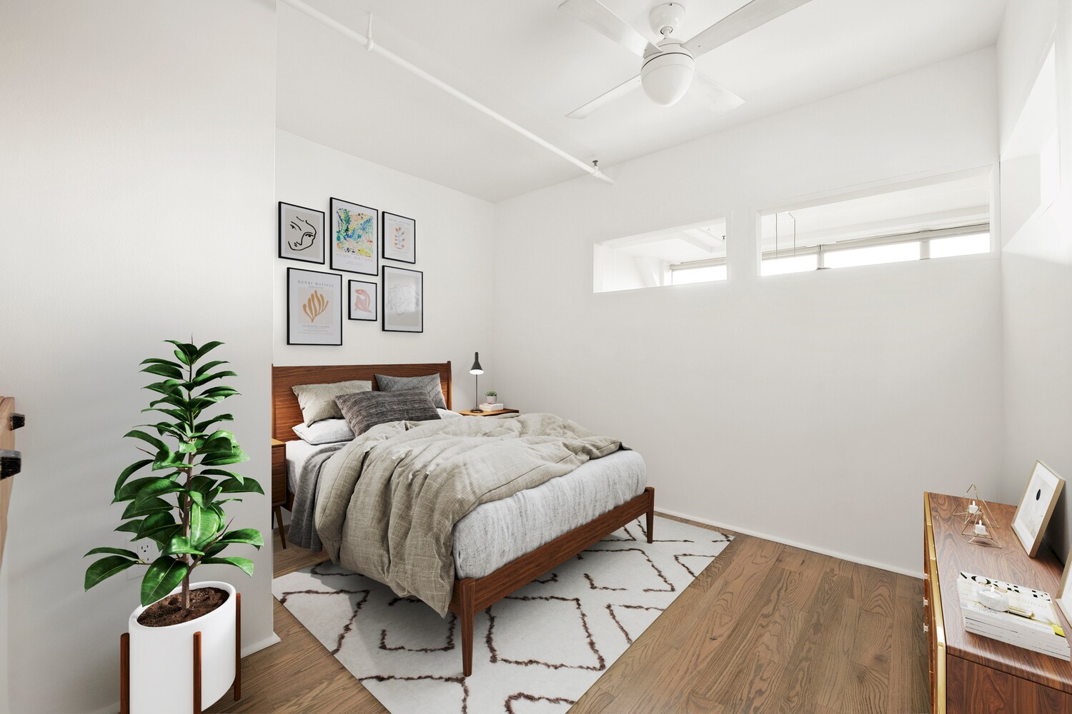 176 Johnson Street, Unit 7C Brooklyn, NY 11201 - Photo 8 of 15 a bed sitting in a bedroom next to a potted plant