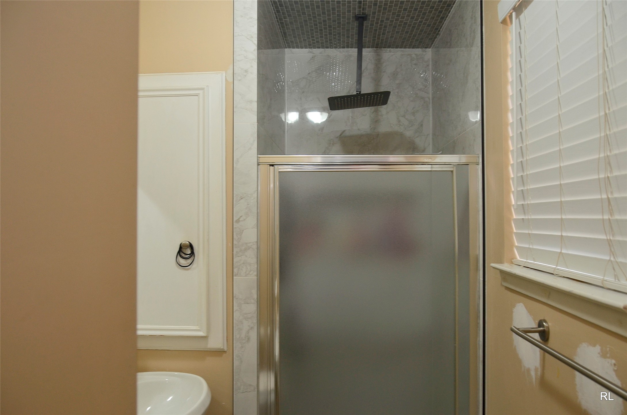 805 Avenue J Rosenberg, TX 77471 - Photo 15 of 22 a view of a bathroom with a shower and a sink