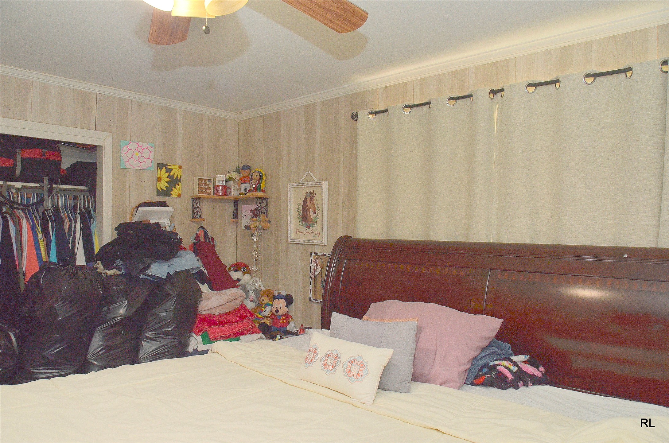 805 Avenue J Rosenberg, TX 77471 - Photo 19 of 22 a bed room with a bed and a couch