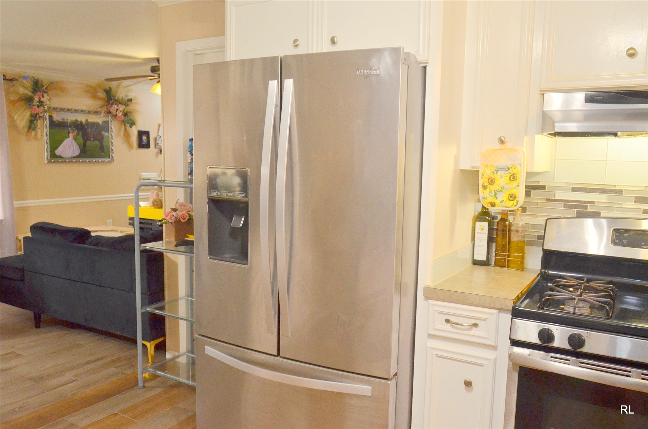 805 Avenue J Rosenberg, TX 77471 - Photo 5 of 22 a kitchen with a refrigerator and a stove