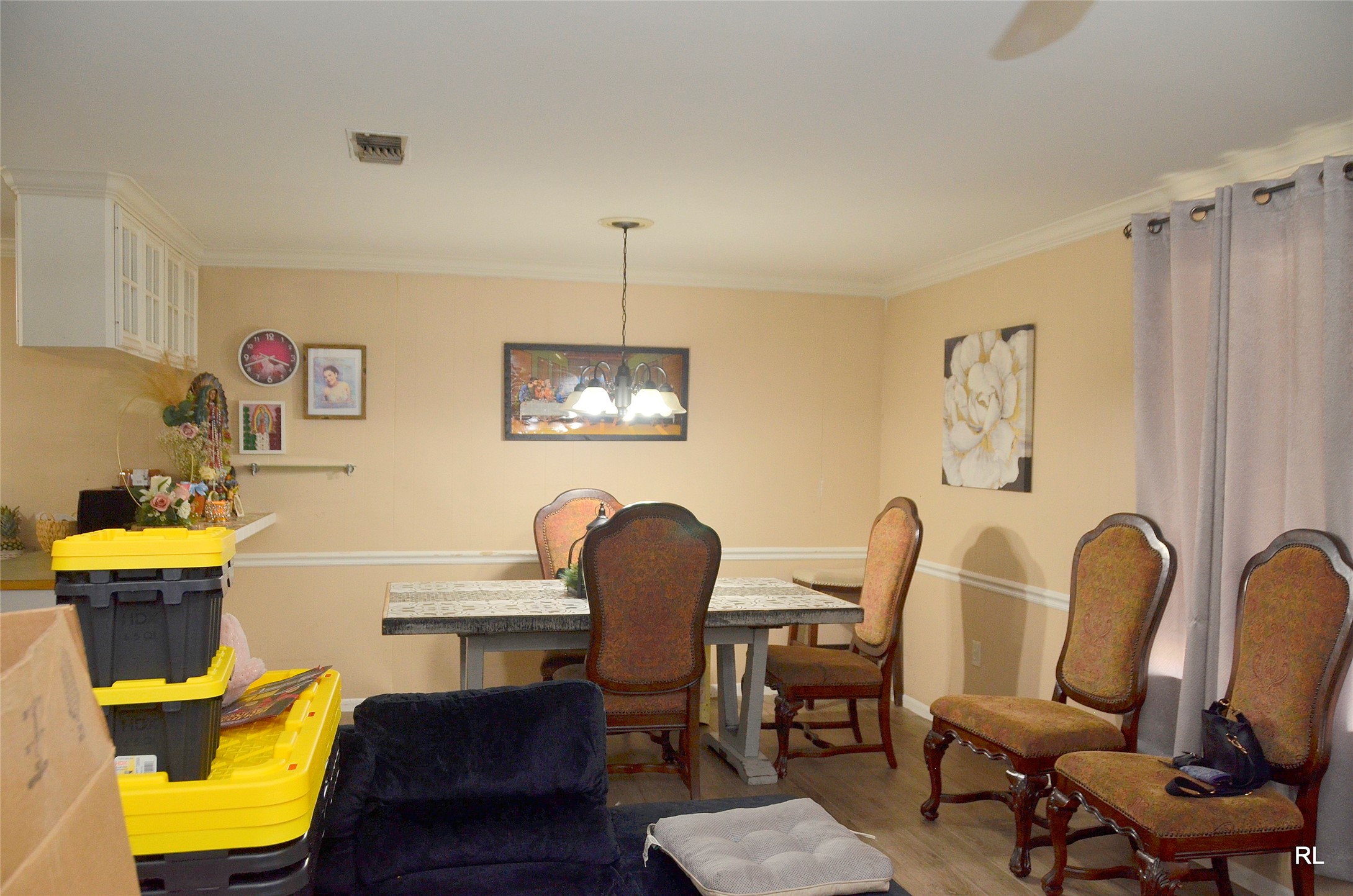 805 Avenue J Rosenberg, TX 77471 - Photo 9 of 22 a view of a dining room with furniture and a chandelier