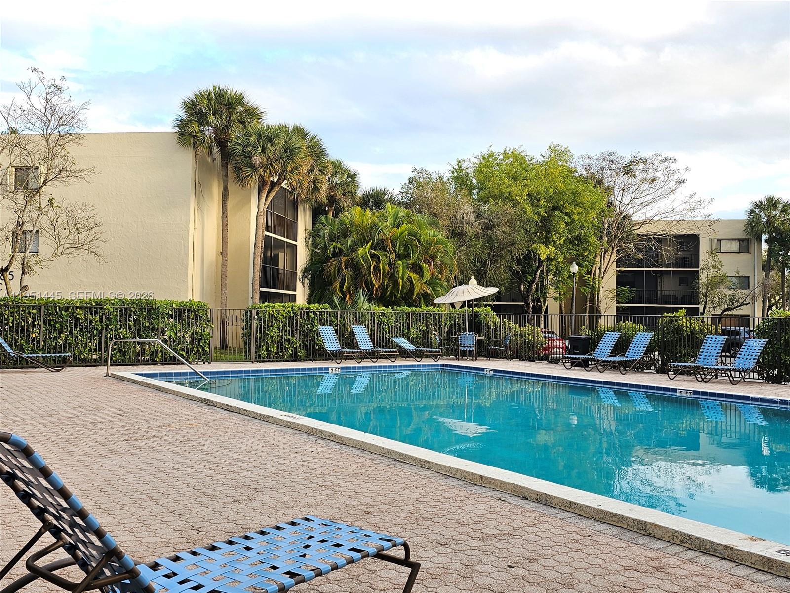 8075 Southwest 107th Avenue, Unit 114 Miami, FL 33173 - Photo 15 of 18 swimming pool view with a outdoor seating space