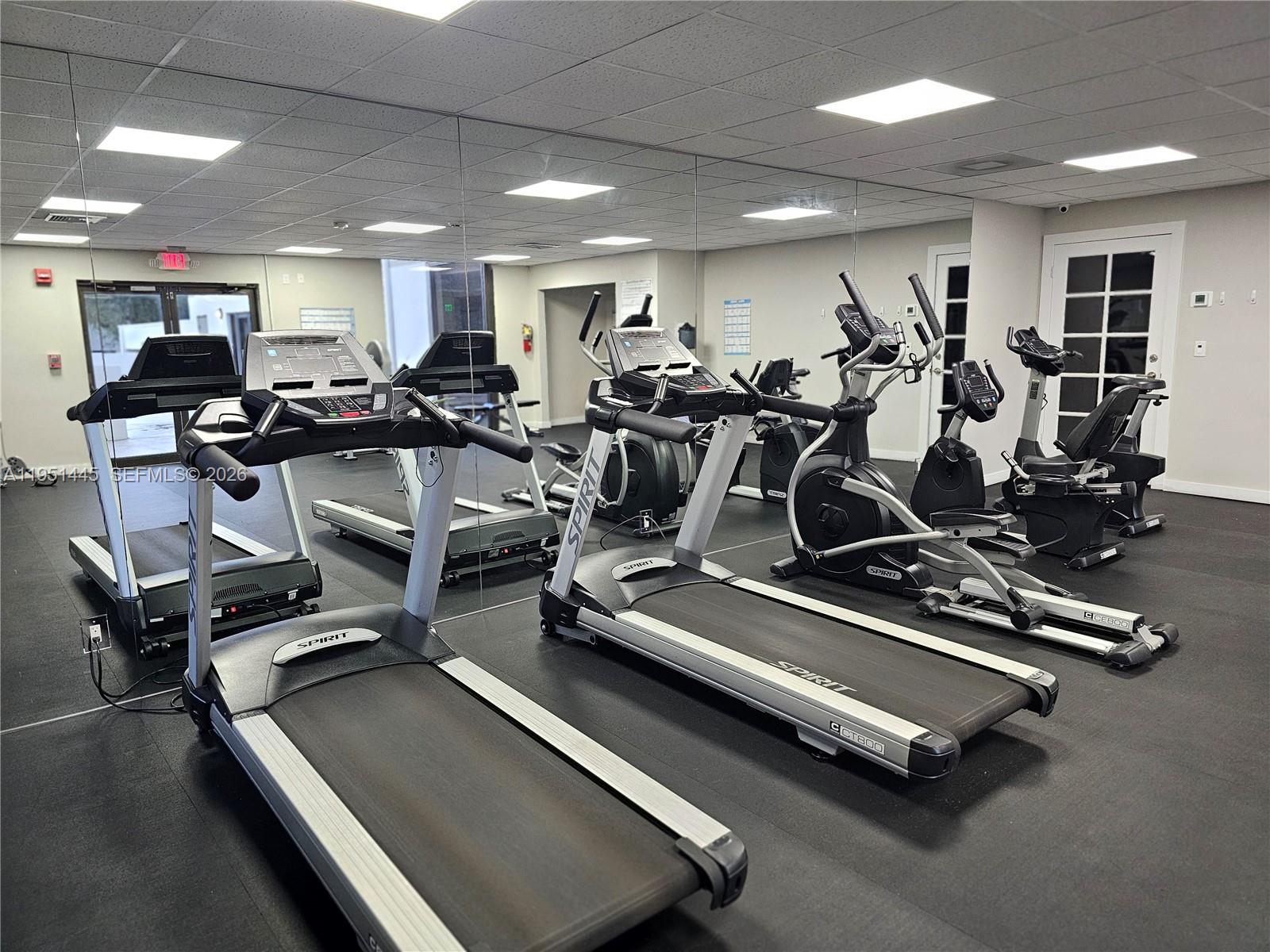 8075 Southwest 107th Avenue, Unit 114 Miami, FL 33173 - Photo 17 of 18 a view of a room with gym equipment