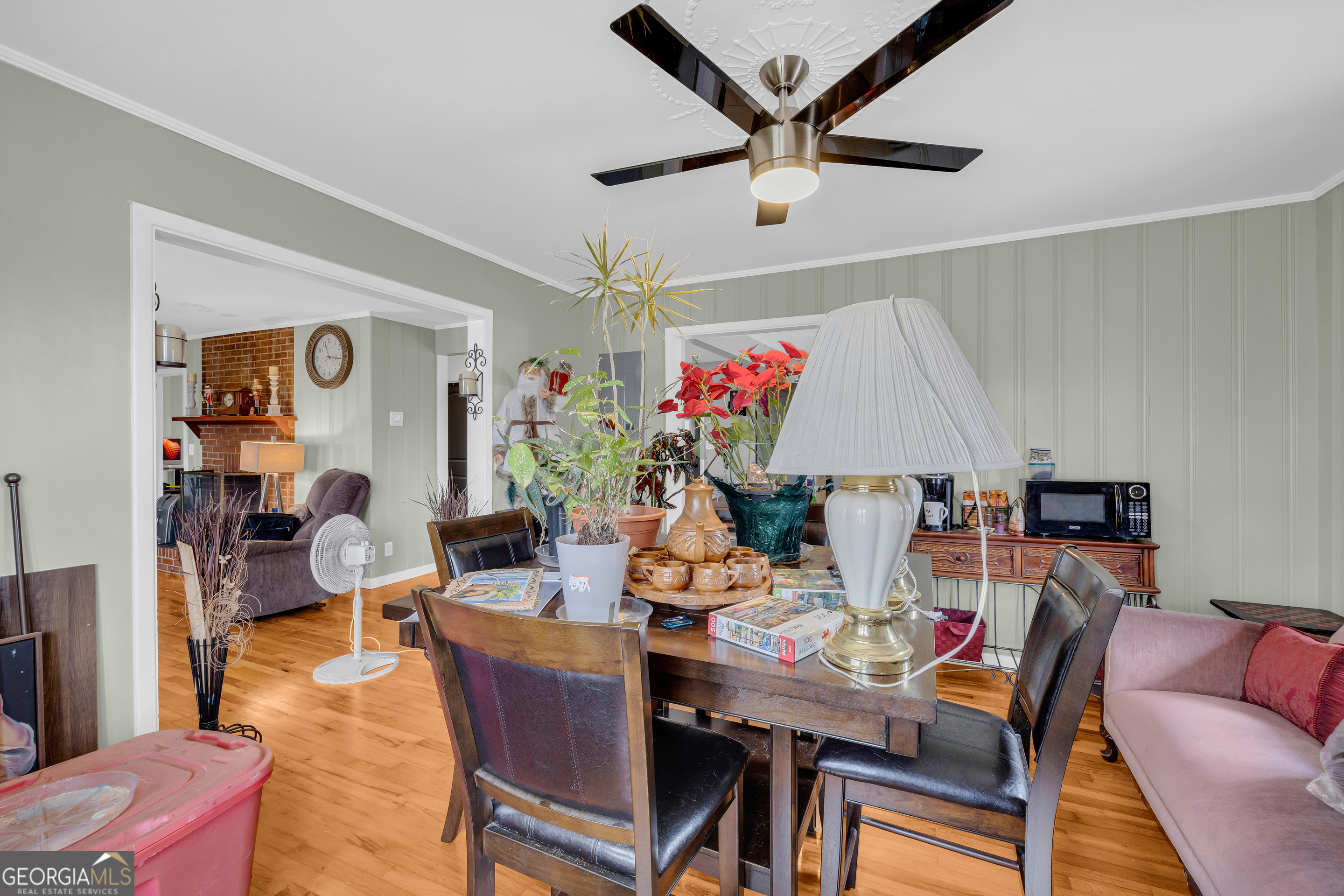 136 Frazier Hill Road Bishop, GA 30621 - Photo 25 of 59 a view of a dining room with furniture and a chandelier