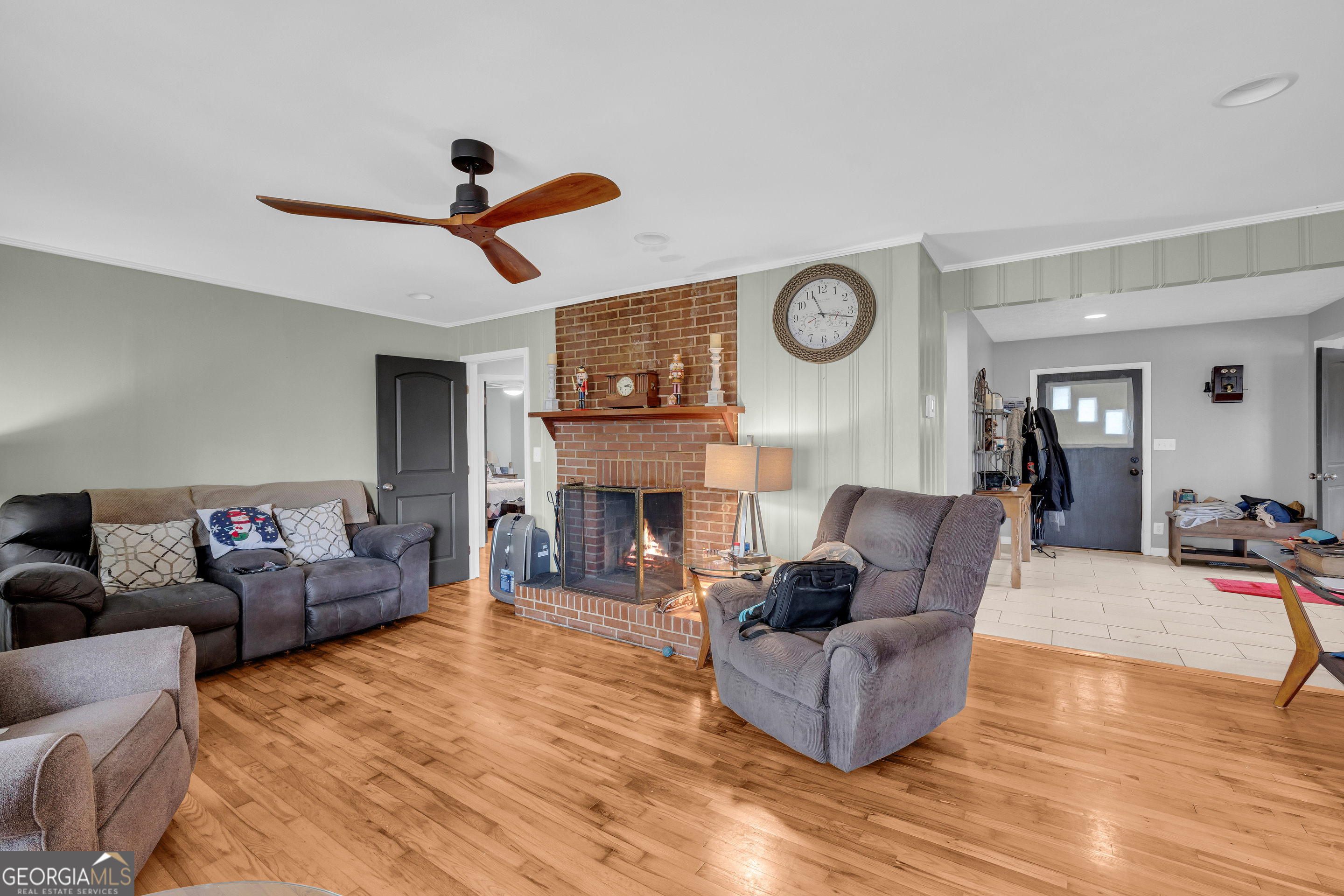 136 Frazier Hill Road Bishop, GA 30621 - Photo 27 of 59 a living room with fireplace furniture and a wooden floor