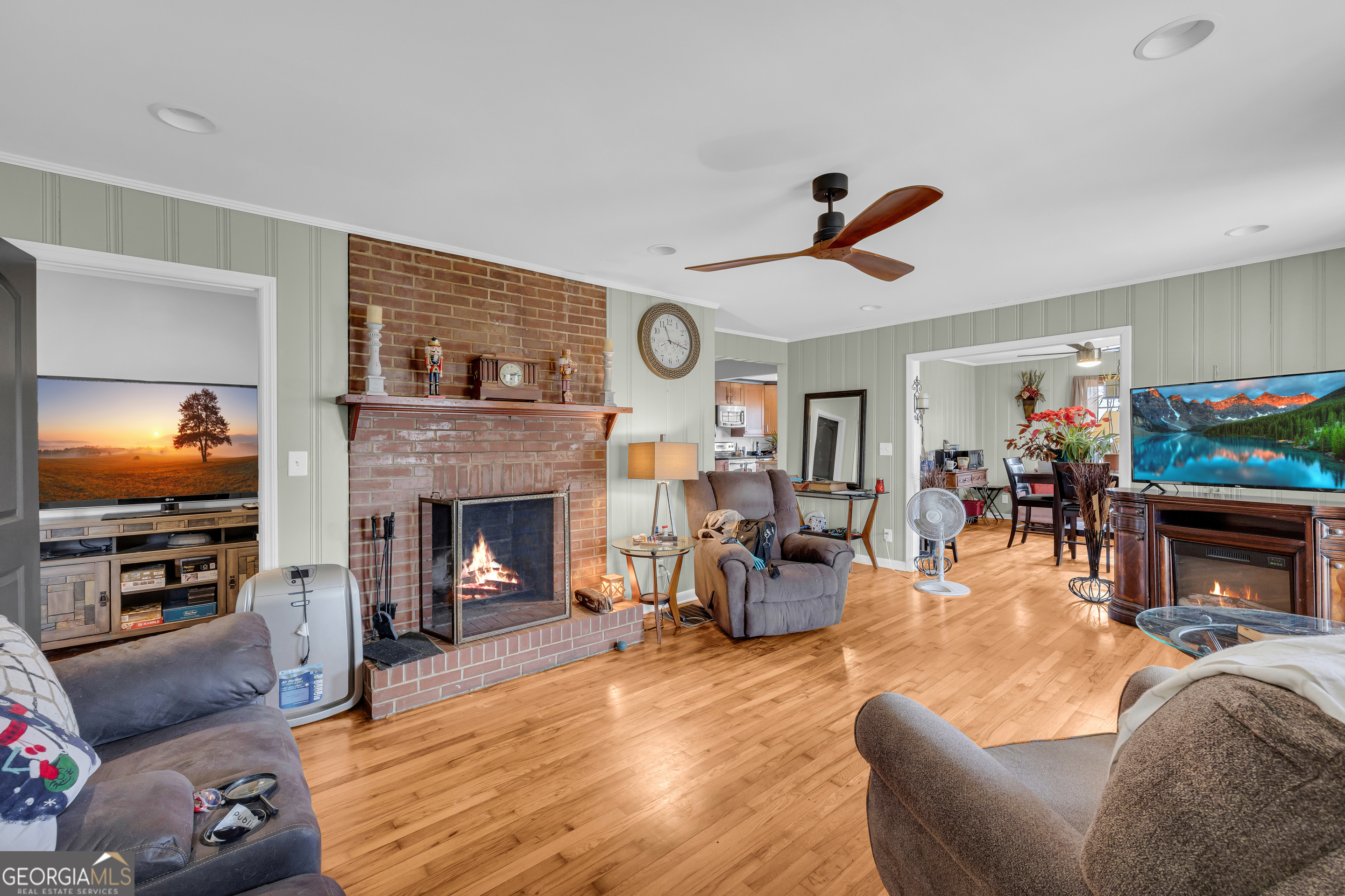 136 Frazier Hill Road Bishop, GA 30621 - Photo 28 of 59 a living room with fireplace furniture and a flat screen tv