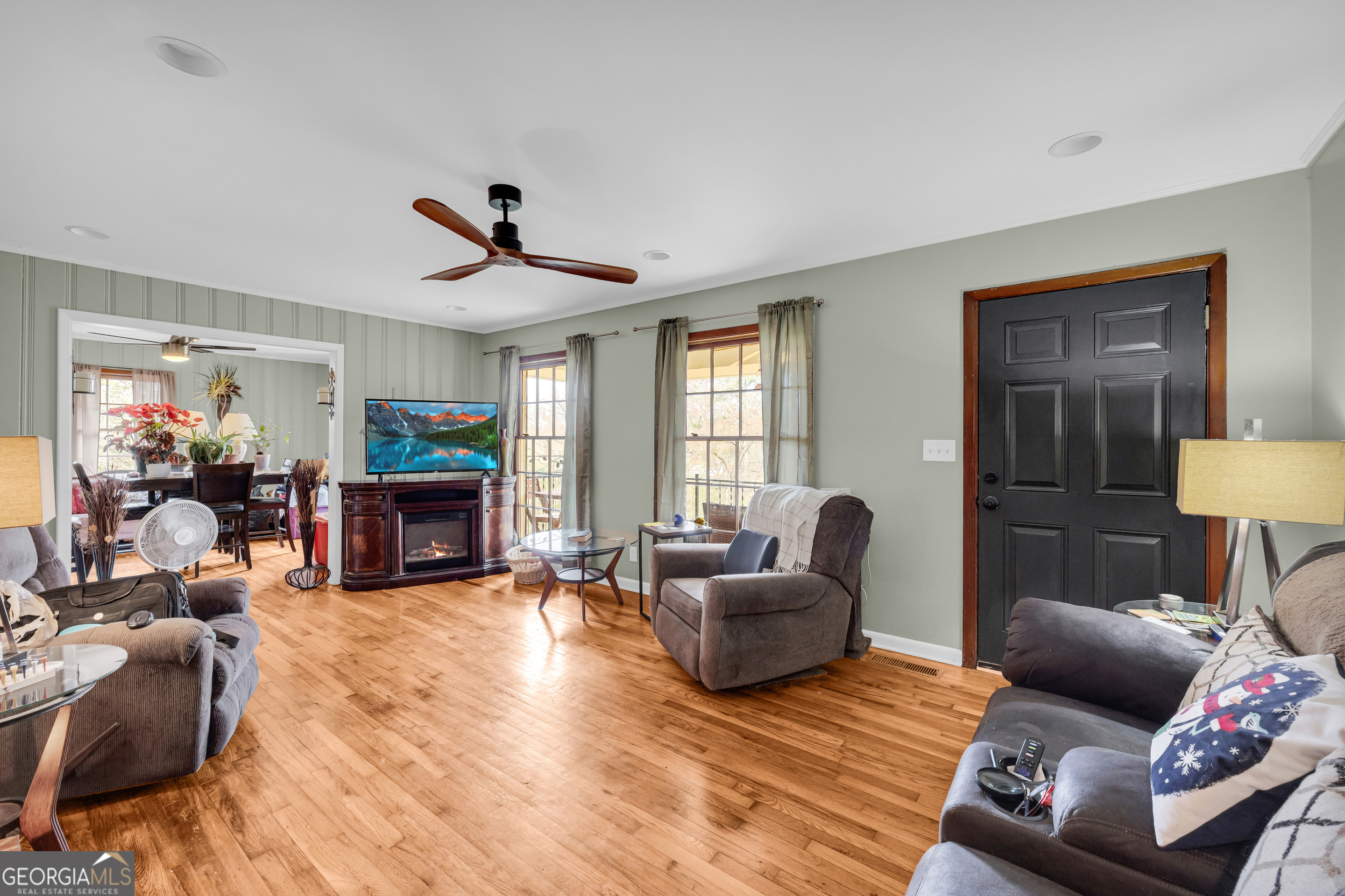 136 Frazier Hill Road Bishop, GA 30621 - Photo 29 of 59 a living room with furniture and a fireplace
