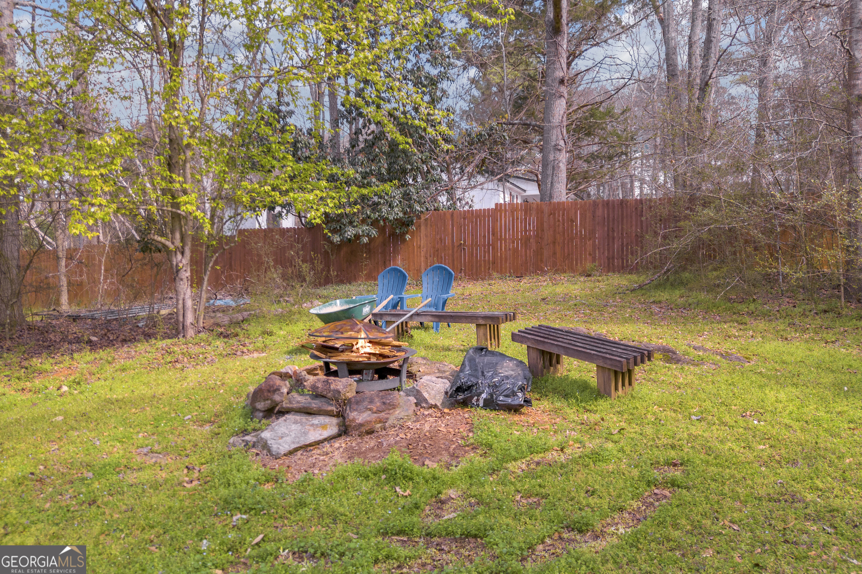 136 Frazier Hill Road Bishop, GA 30621 - Photo 4 of 59 a backyard of a house with table and chairs