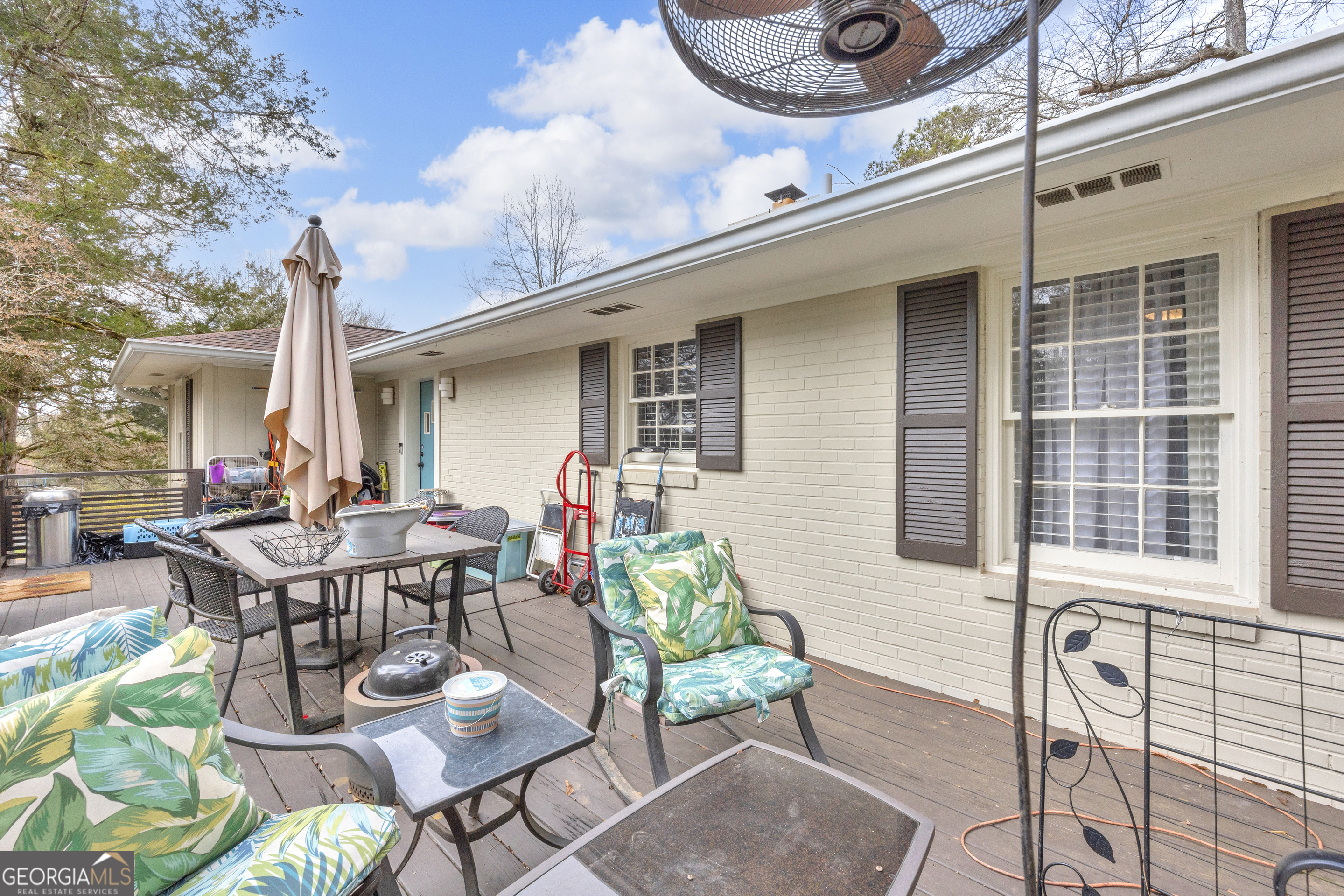 136 Frazier Hill Road Bishop, GA 30621 - Photo 42 of 59 a view of a patio with table and chairs and potted plants