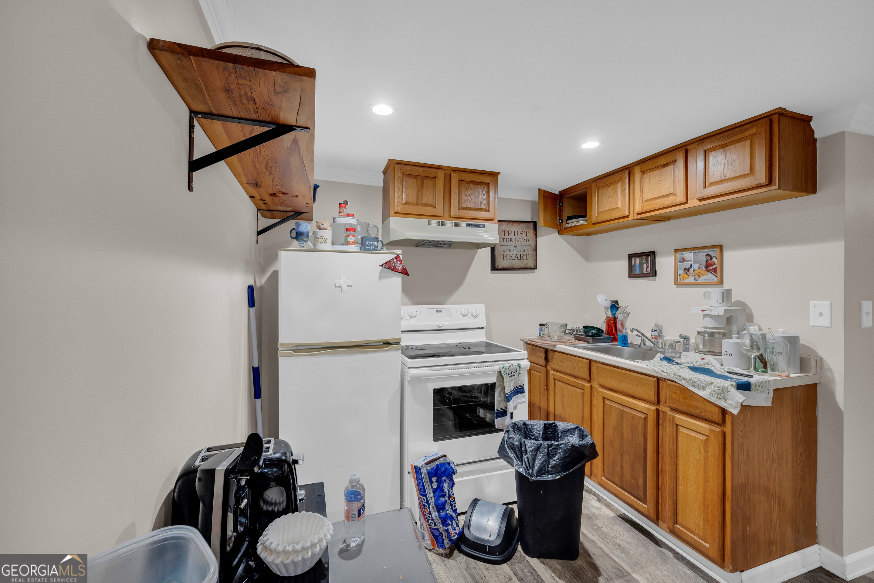 136 Frazier Hill Road Bishop, GA 30621 - Photo 49 of 59 a kitchen with a refrigerator and a sink