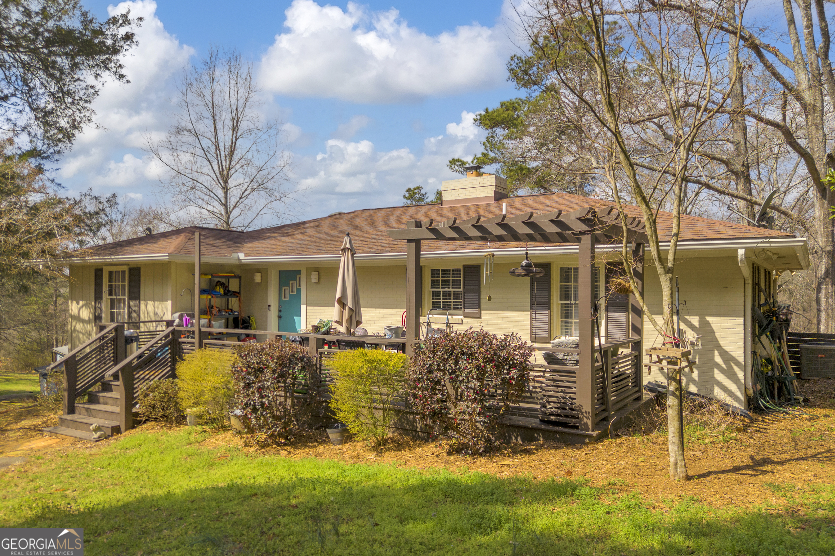136 Frazier Hill Road Bishop, GA 30621 - Photo 5 of 59 a view of a house with patio next to a yard