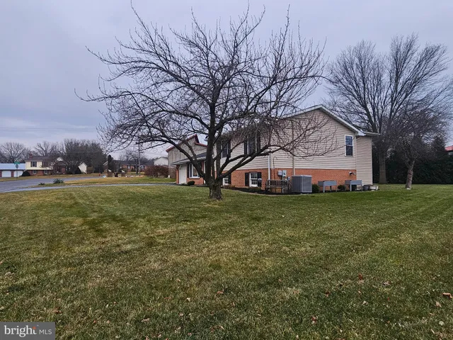 a view of a house with a big yard